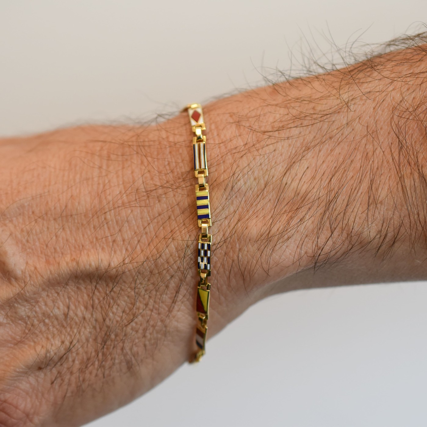 Bracciale uomo bandierine oro giallo