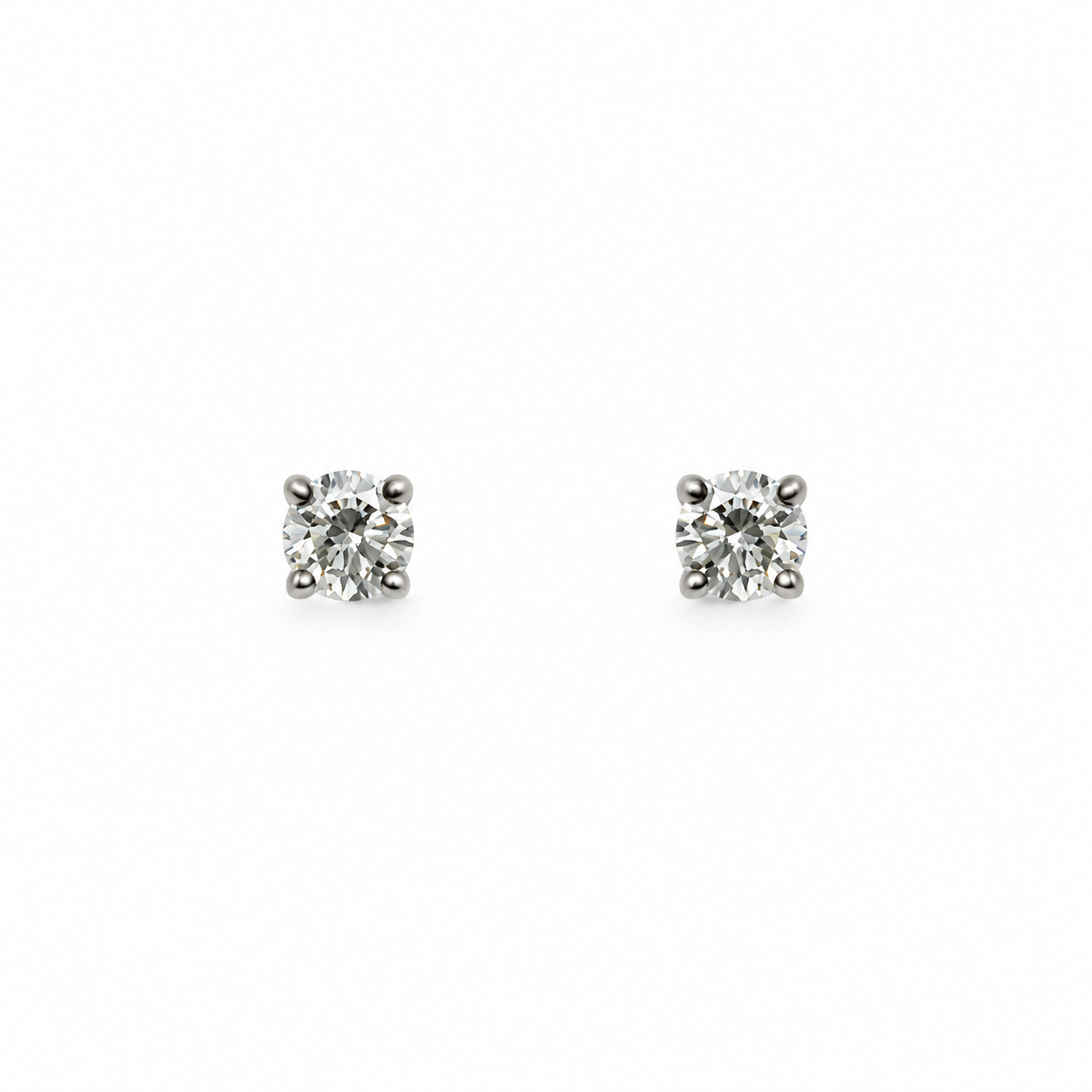 Orecchini punto luce oro bianco e diamanti 0,25 ct